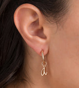 Hoop earrings with golden logo